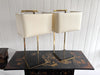 A Pair of Large 1970's Brass Plated Table Lamps on Rippled Black Bases