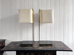 A Pair of Large 1970's Brass Plated Table Lamps on Rippled Black Bases