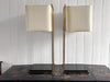 A Pair of Large 1970's Brass Plated Table Lamps on Rippled Black Bases
