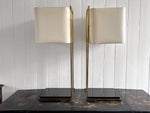 A Pair of Large 1970's Brass Plated Table Lamps on Rippled Black Bases