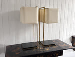 A Pair of Large 1970's Brass Plated Table Lamps on Rippled Black Bases