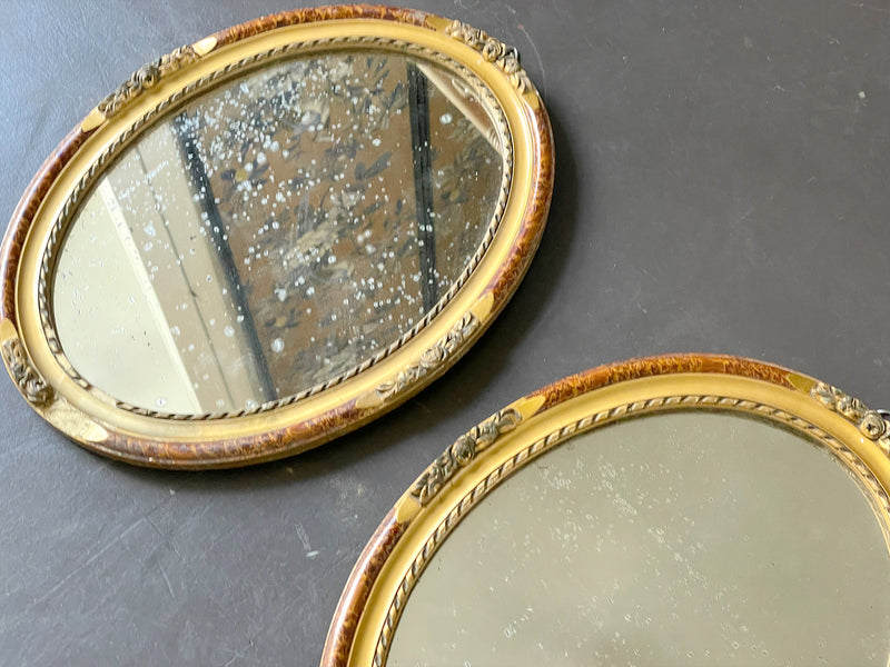 A Pair of Antique French Giltwood Oval Mirrors with Faux Tortoiseshell decoration