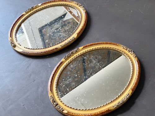 A Pair of Antique French Giltwood Oval Mirrors with Faux Tortoiseshell decoration