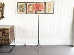 A 1950's French Black Metal Standing Lamp with Tripod BaseA 1950's French Black Metal Standing Lamp with Tripod Base