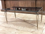 A 1960's French Coffee Table with Black Mirrored Top and Brass Tripod Legs