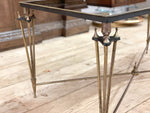 A 1960's French Coffee Table with Black Mirrored Top and Brass Tripod Legs