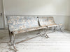 A Pair of Late 19th Century French Painted Iron Scroll Back Benches