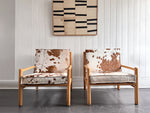 A Pair of 1970's Italian Lounge Armchairs with Cowhide Upholstery