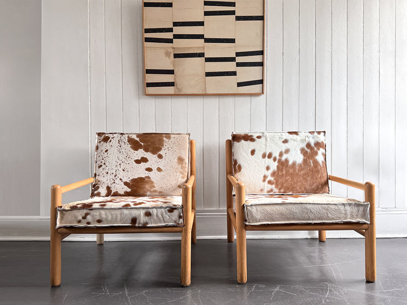 A Pair of 1970's Italian Lounge Armchairs with Cowhide Upholstery
