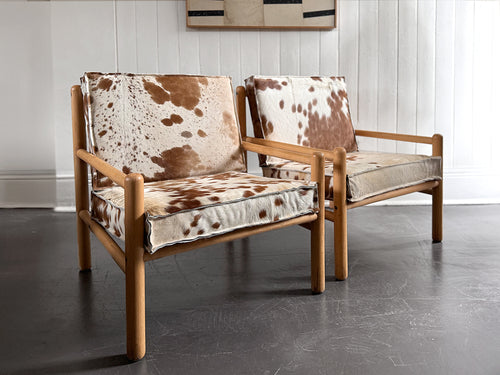 A Pair of 1970's Italian Lounge Armchairs with Cowhide Upholstery