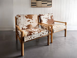 A Pair of 1970's Italian Lounge Armchairs with Cowhide Upholstery
