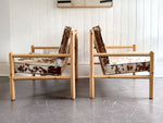 A Pair of 1970's Italian Lounge Armchairs with Cowhide Upholstery