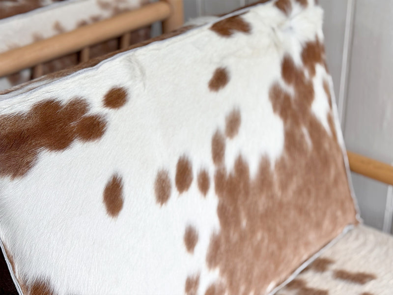 A Pair of 1970's Italian Lounge Armchairs with Cowhide Upholstery