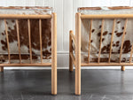 A Pair of 1970's Italian Lounge Armchairs with Cowhide Upholstery