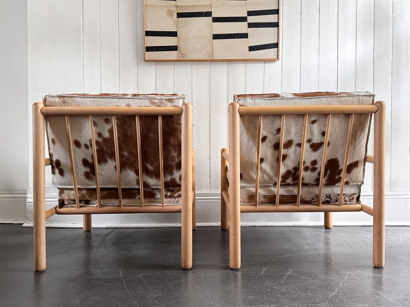 A Pair of 1970's Italian Lounge Armchairs with Cowhide Upholstery