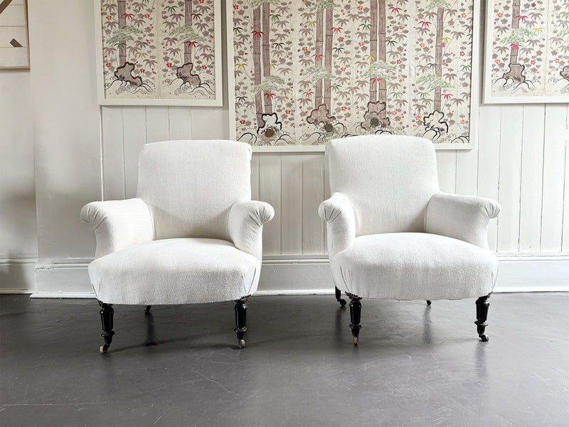 A Pair of Napoleon III Scroll Back Linen Covered Armchairs