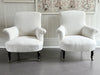 A Pair of Napoleon III Scroll Back Linen Covered Armchairs