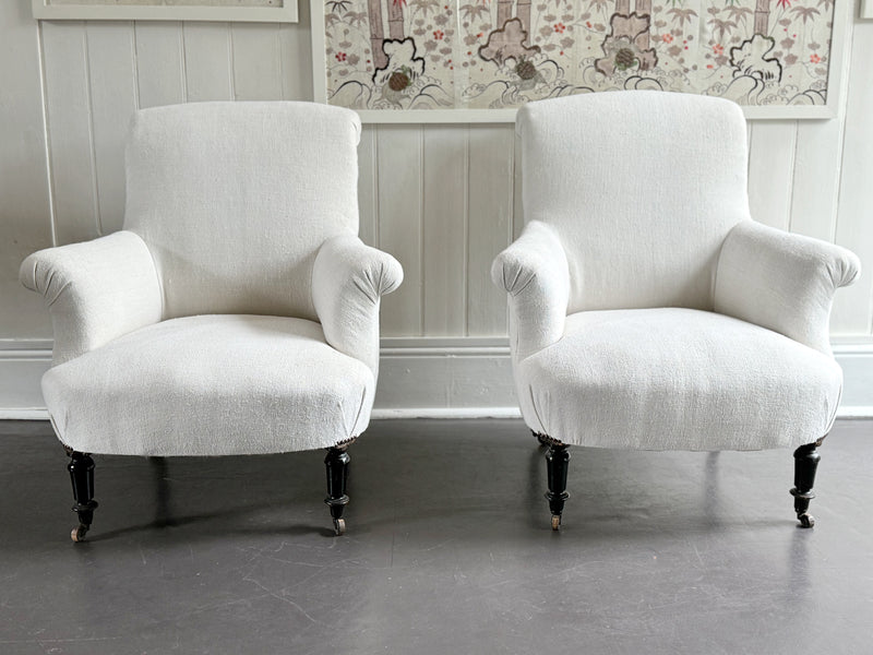 A Pair of Napoleon III Scroll Back Linen Covered Armchairs