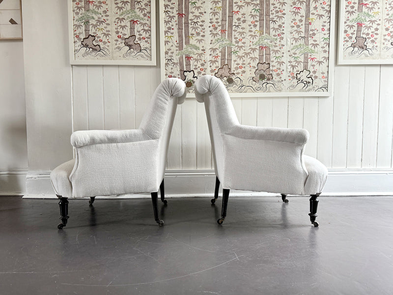 A Pair of Napoleon III Scroll Back Linen Covered Armchairs