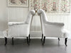 A Pair of Napoleon III Scroll Back Linen Covered Armchairs