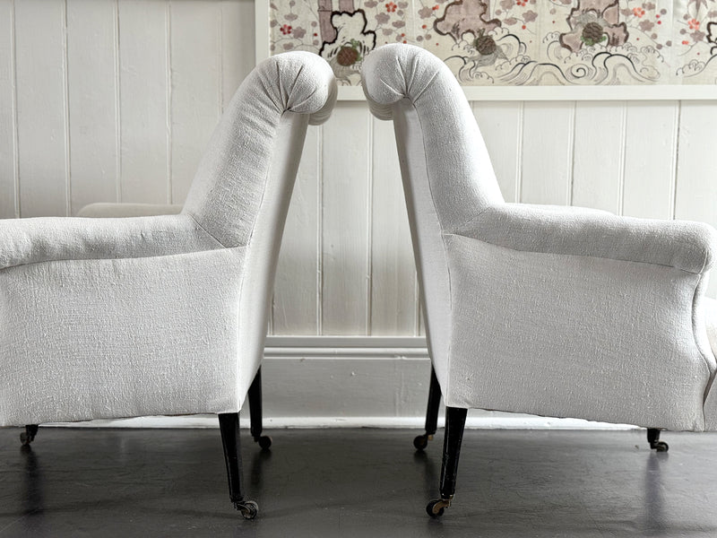 A Pair of Napoleon III Scroll Back Linen Covered Armchairs