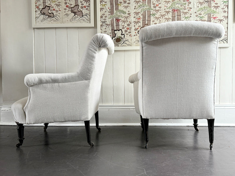 A Pair of Napoleon III Scroll Back Linen Covered Armchairs