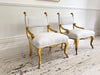 A Pair of Petite Regency Gilt Wood Armchairs