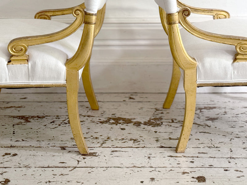 A Pair of Petite Regency Gilt Wood Armchairs