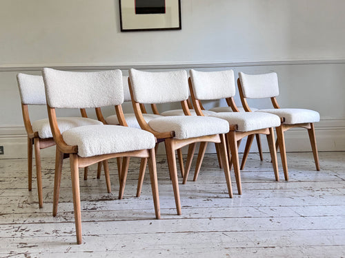 A Set of Eight 1960's Dining Chairs with Bouclé Upholstery
