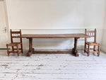 A Set of 8 Antique Spanish Folk Art Dining Chairs with Woven Seats