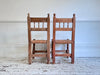 A Set of 8 Antique Spanish Folk Art Dining Chairs with Woven Seats