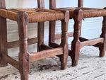 A Set of 8 Antique Spanish Folk Art Dining Chairs with Woven Seats