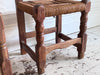 A Set of 8 Antique Spanish Folk Art Dining Chairs with Woven Seats