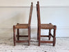 A Set of 8 Antique Spanish Folk Art Dining Chairs with Woven Seats