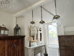 A Set of Three Czechoslovakian Glass Globe Pendant Lights