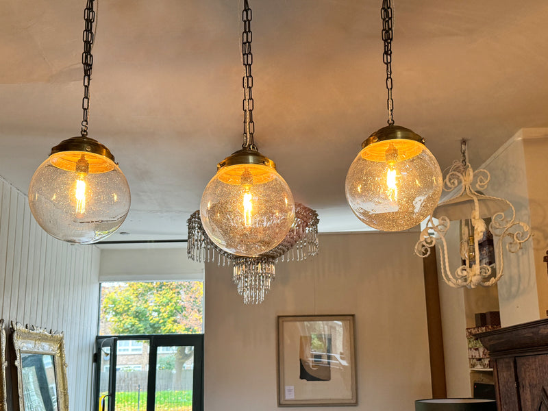 A Set of Three Czechoslovakian Glass Globe Pendant Lights