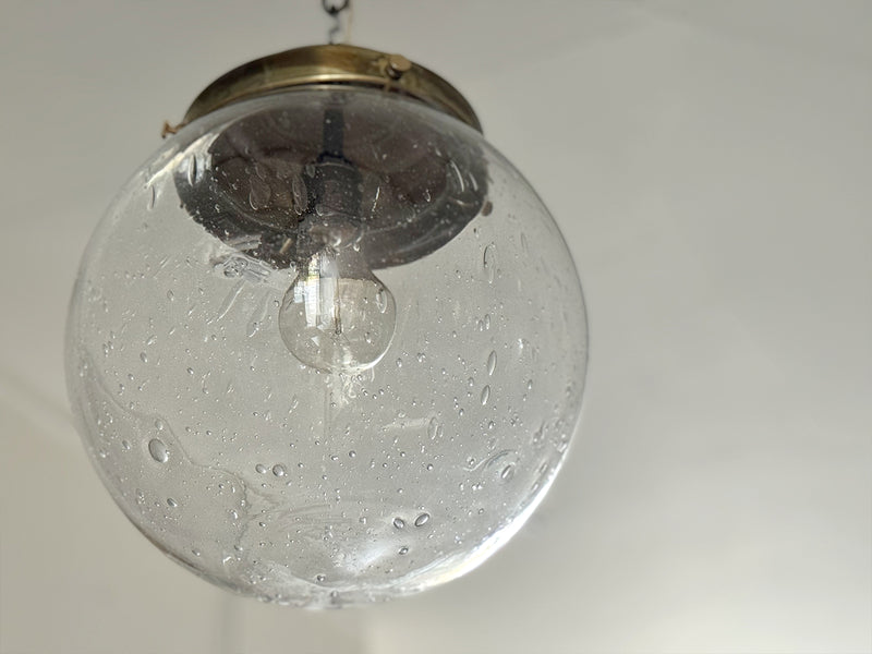 A Set of Three Czechoslovakian Glass Globe Pendant Lights