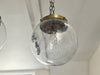 A Set of Three Czechoslovakian Glass Globe Pendant Lights