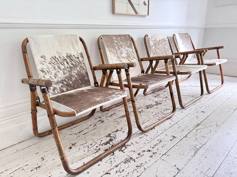 Two Pairs of 1970's Folding Bamboo Cowhide Armchairs