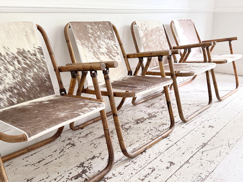 Two Pairs of 1970's Folding Bamboo Cowhide Armchairs