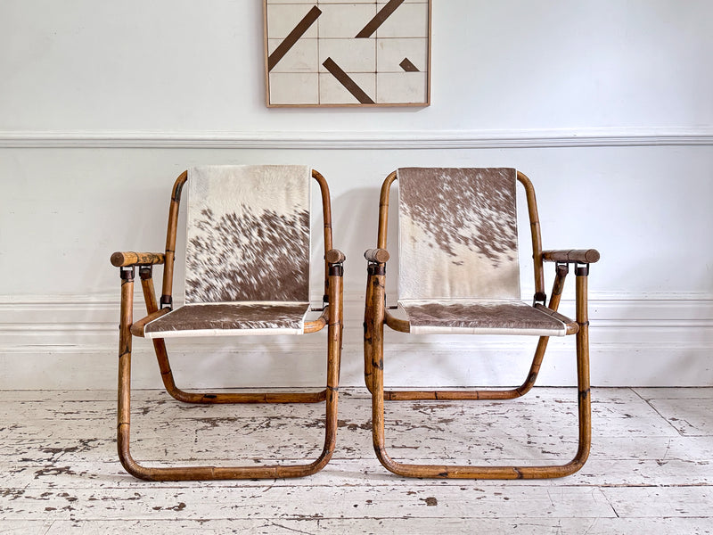 Two Pairs of 1970's Folding Bamboo Cowhide Armchairs
