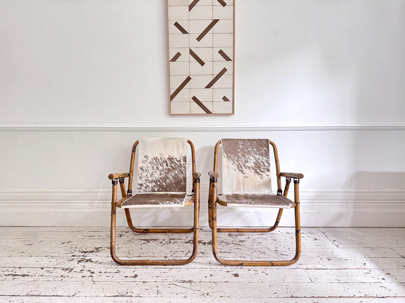 Two Pairs of 1970's Folding Bamboo Cowhide Armchairs