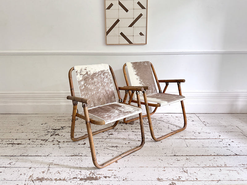 Two Pairs of 1970's Folding Bamboo Cowhide Armchairs