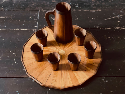 A 1920's Wooden Tray with Six Matching Cups and Jugs