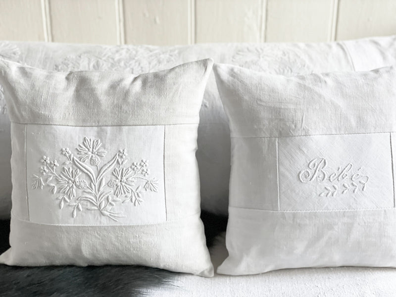 Bébé - An Antique French White on White 'Bébé' Embroidered 30cm Cushion