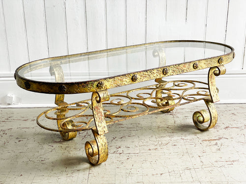 A 1950's Spanish Gilt Metal Coffee Table with Glass Top
