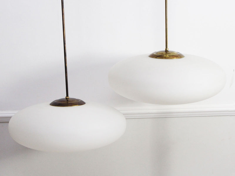 A Pair of Stilnovo Opaque Glass & Brass Pendant Lights