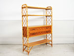 A 1950's French bamboo & rattan shelf unit with two drawers
