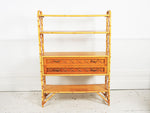 A 1950's French bamboo & rattan shelf unit with two drawers