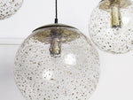 A 1970's French Set of Three Hand Blown Glass Globes with Gold Flecks